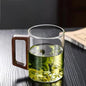 High end green tea cup with walnut handle and lid. High temperature resistant glass office drinking cup